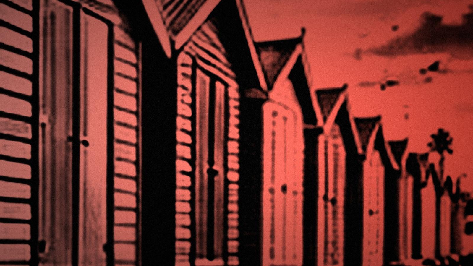 A row of beach bathing boxes